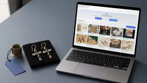 An open laptop showing the Loupe Factory Media Gallery with 10 AI product shots of gold chandelier earrings, next to the same pair on a black velvet pad with a brass jeweler's loupe and a blue price tag, on a slate-blue workbench.